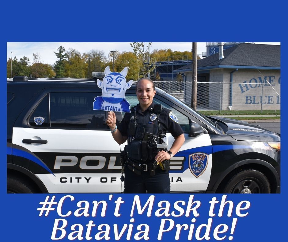 Officer Stevens holding Blue Devil Face with caption, Can't Mask the Batavia Pride!
