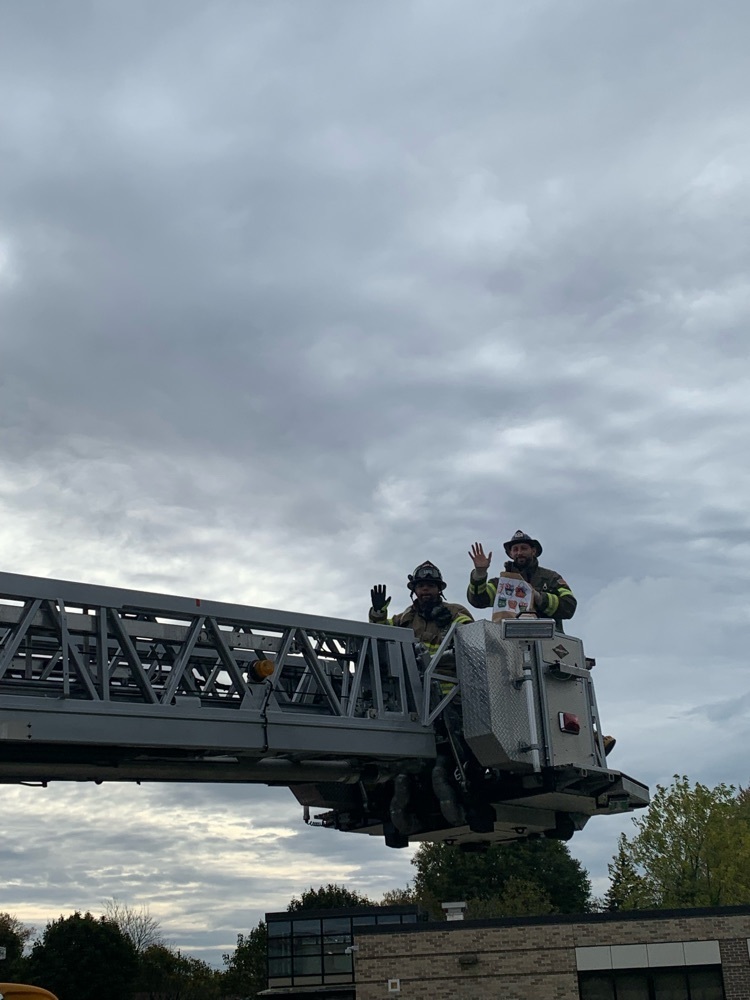 Yes that’s Principal Sutton handing out candy like a real firefighter!